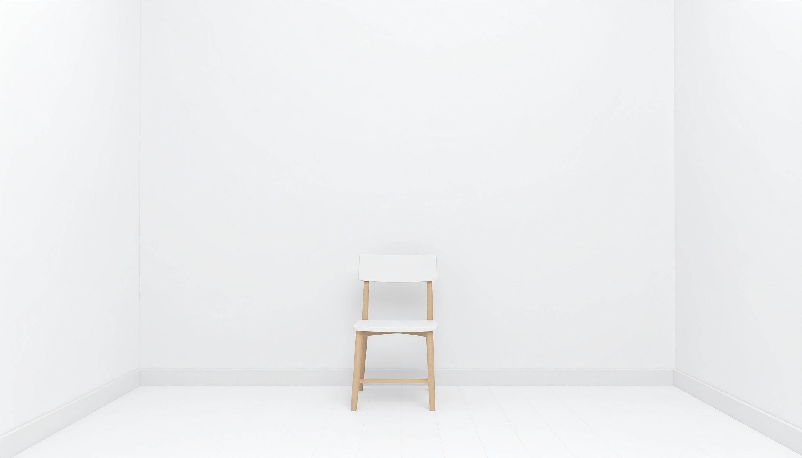 白い部屋にイスがある背景フリー素材