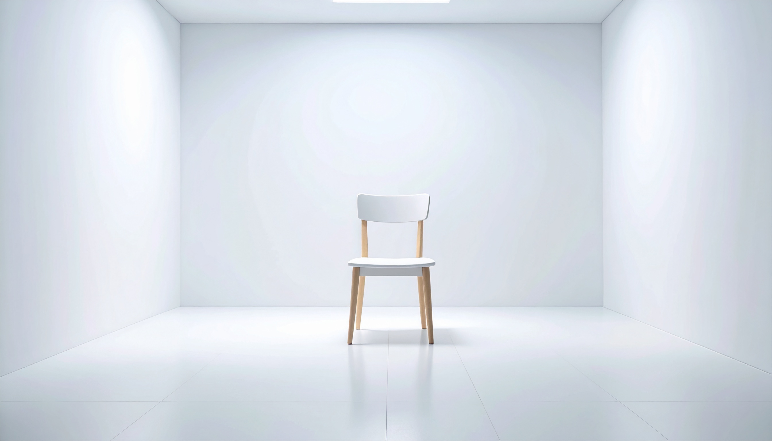 白い部屋にイスがある背景フリー素材